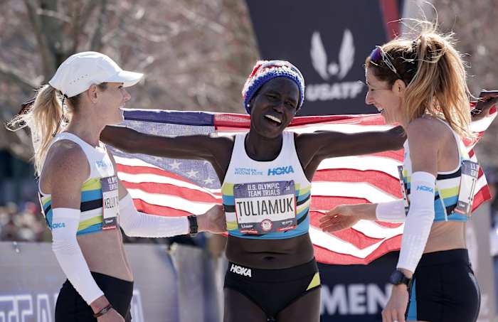 Tuliamuk (center) celebrated with Kellyn Taylor (left) and Bruce after winning the U.S. Olympic Team Trials marathon in 2020.